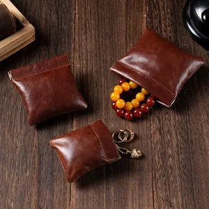 Pochette à bijoux vintage en cuir de vachette ciré avec fermeture automatique