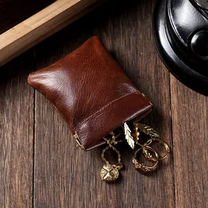 Pochette à bijoux vintage en cuir ciré marron avec fermeture automatique par ressort