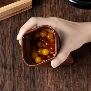 Pochette à bijoux vintage en cuir marron avec fermeture automatique pour pièces