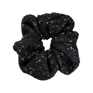 Elegant black felt scrunchie with gold metallic flecks for autumn winter hair styling
