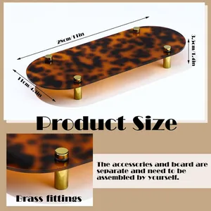 Detailed view of a stylish tortoiseshell acrylic tray featuring brass legs and dimensions