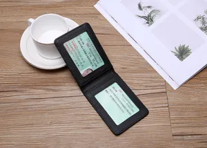 Detail view of premium black slim leather license holder featuring dual clear PVC windows