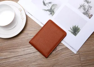 Minimalist brown lychee leather driver's license and document holder detail view.