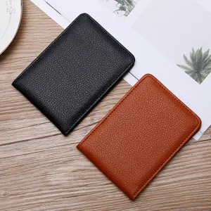 Minimalist pebbled leather driving license covers in black and brown, ultra-slim design.