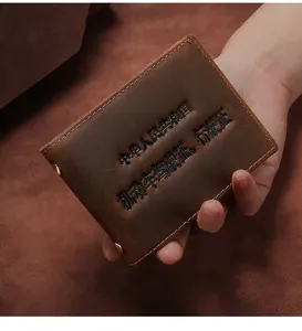 Close-up view of a vintage brown crazy horse leather driver's license and ID holder case