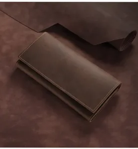 Detail view of the brown leather long wallet, showing premium crazy horse texture and design.