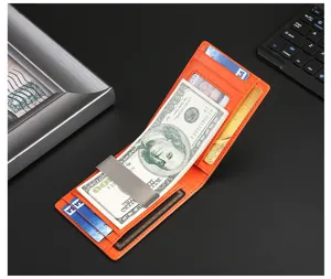 Vista interior de cartera de cuero naranja con clip para billetes metálico y ranuras