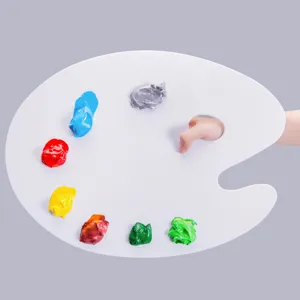 Close-up of white oval artist palette with vibrant wet paint blobs for acrylic and oil painting