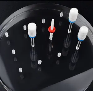 Close-up of 12-hole transparent acrylic nail drill bit display stand with bits