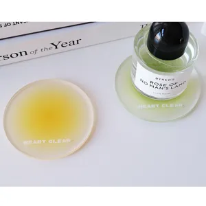 Close-up showing the elegant frosted texture of yellow and green acrylic coasters