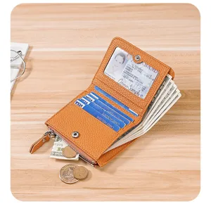 Detail view of genuine brown leather wallet showing card slots, ID window, and coin pouch