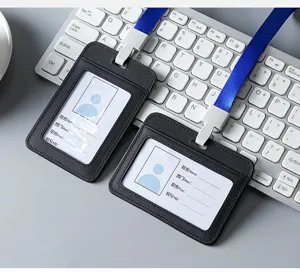 High-quality leather ID badge holder with blue lanyard on a white keyboard.
