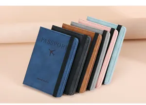 Detailed view of multiple colored travel passport wallets with elastic bands, close up display.