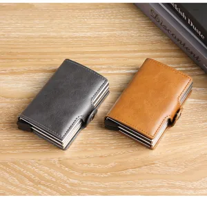Vista superior de tarjeteros automáticos de doble capa en cuero gris y marrón