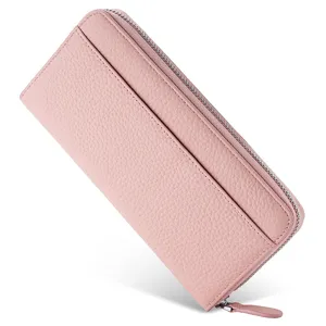 Pink leather long wallet detail, zipper closure, card slots, textured leather surface.