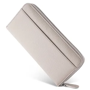 Leather long wallet detail showing texture, zipper, and card slot design in light grey.