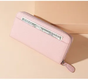 Genuine leather long zip wallet for women, pink card holder clutch bag detail view.