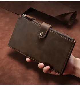 Detailed hand-held view of vintage dark brown crazy horse leather long wallet for men