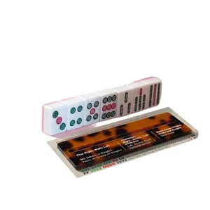 Detailed view of tortoise shell acrylic mahjong line reader over a game card