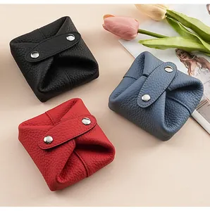 Detail of colorful mini leather coin pouches for earphones and lipstick storage