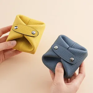 Handheld mini genuine leather coin purses in yellow and blue with metal snap closure