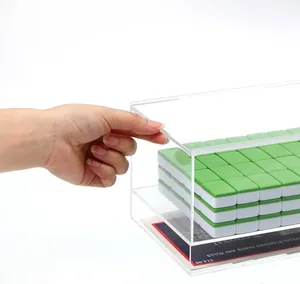 Detailed macro view of clear acrylic mahjong storage box with sliding lid mechanism