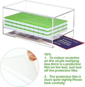 Macro view of clear acrylic mahjong box with detailed protective film removal tips