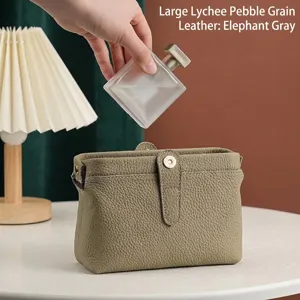 Premium elephant grey cowhide leather makeup bag with elegant litchi grain texture