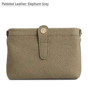 Genuine pebbled leather cosmetic bag in elegant elephant grey with snap button closure.