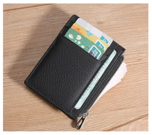 Detailed close-up of a black genuine leather card holder with zipper pocket and slots