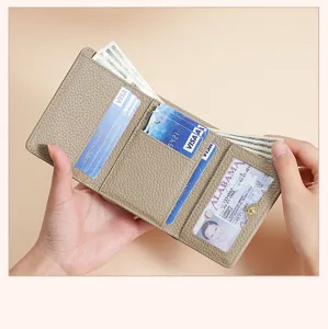 Interior detail of a genuine leather tri-fold wallet showing card slots and ID window