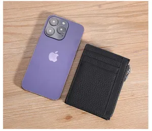 Genuine leather card holder wallet shown next to a smartphone for size comparison scale