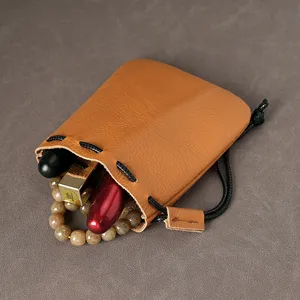 Vintage echt lederen zakje met trekkoord voor munten en kleine accessoires in bruin
