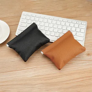 Mini lychee texture leather coin purse with spring clip closure in black and brown colors
