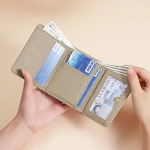 Beige genuine leather tri-fold wallet for women showing interior card slots and ID window