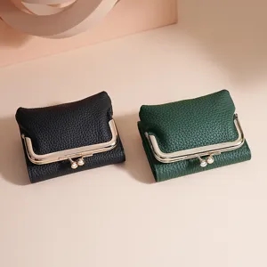 Two elegant pebble grain leather tri-fold kiss-lock wallets in black and dark green.