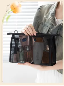 Interior detail of large capacity black mesh cosmetic bag for travel organization