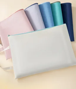 Close-up of A4 canvas file bags showing assorted Morandi colors and woven texture