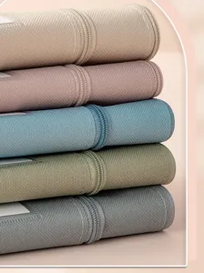 Close-up of stacked Morandi color Oxford cloth waterproof document storage bags