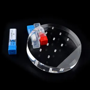 Clear acrylic nail drill bit display stand with 12 holes for organized tool storage.