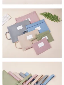 Detail view of colorful Morandi Oxford waterproof file bags with index labels and handles.