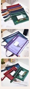 Detailed view of colorful A4 mesh file bags with zippers and index card slots