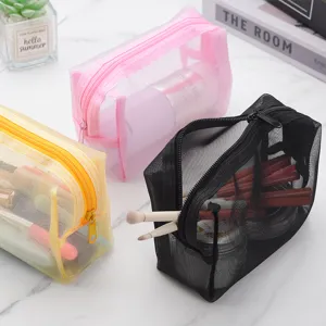 Set aus drei tragbaren Mesh-Kosmetiktaschen in Pink, Gelb und Schwarz für die Reise