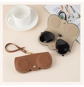 Detail of portable leather sunglasses case with protective air cushion design