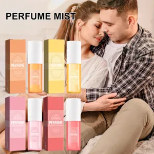 Collection of OUHOE perfume mists in four unique scents shown with matching gift boxes