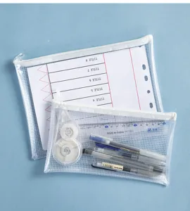 Macro detail of transparent PVC mesh storage bags showing zipper closure and stationery