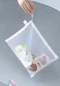 Detail of transparent A4 mesh zipper bag used for storing puzzles and stationery