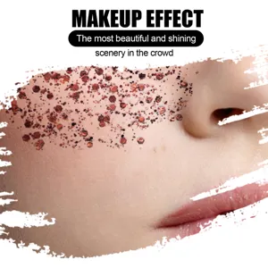 Macro view of shining bronze glitter gel applied on the cheek for professional stage makeup effect