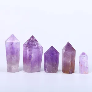 Set of five natural hexagonal amethyst crystal pillars for home and office decoration