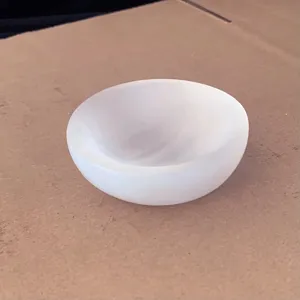 Detailed view of a white translucent selenite bowl for crystal cleansing and decor